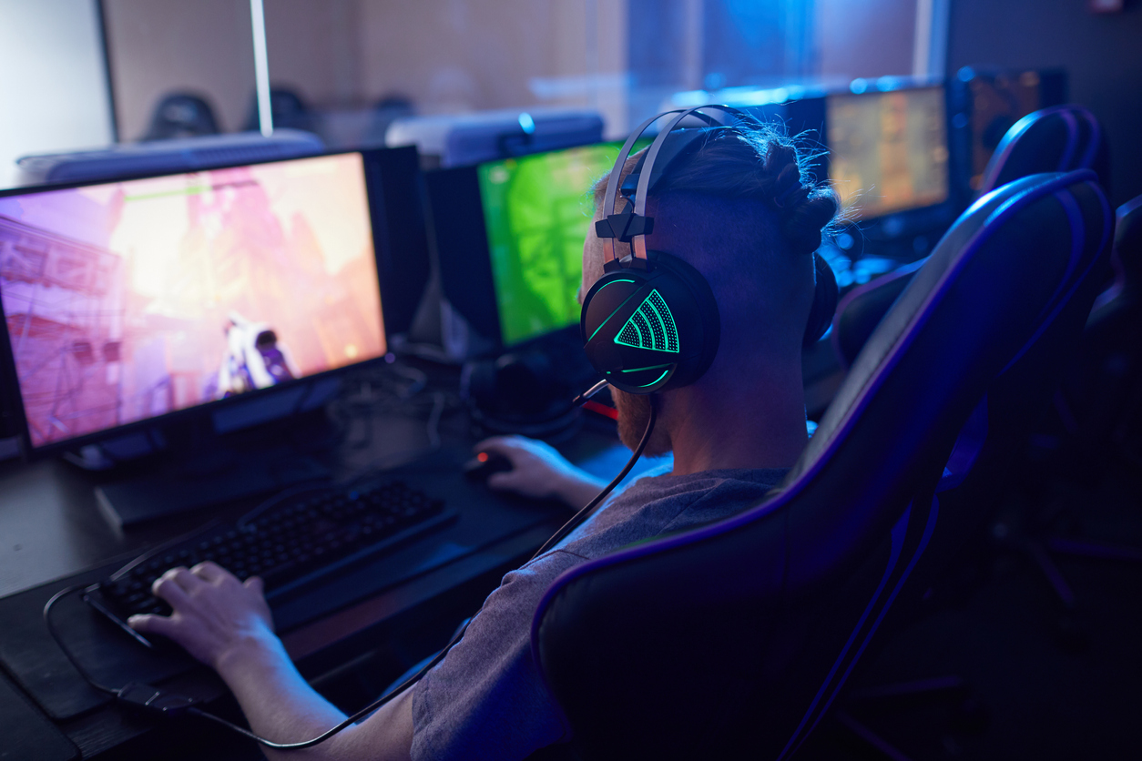 Man playing video games on computer