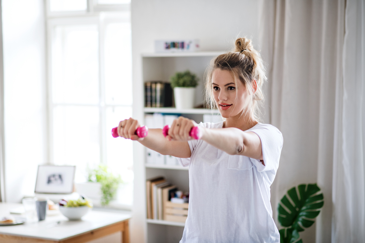 woman doing physical therapy exercises at home