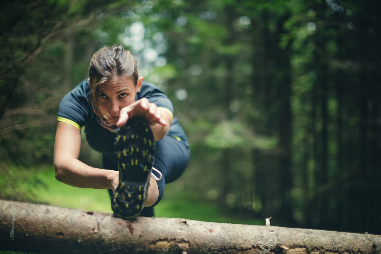 woman stretching before running